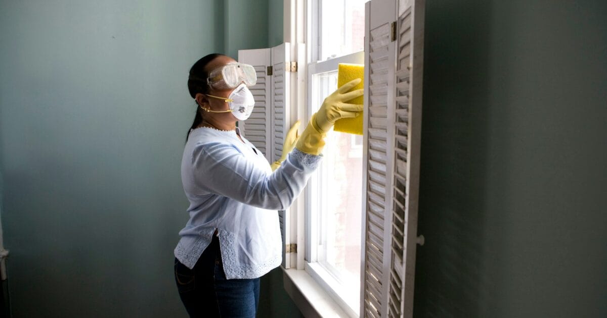 Paint roller applying color to a wall